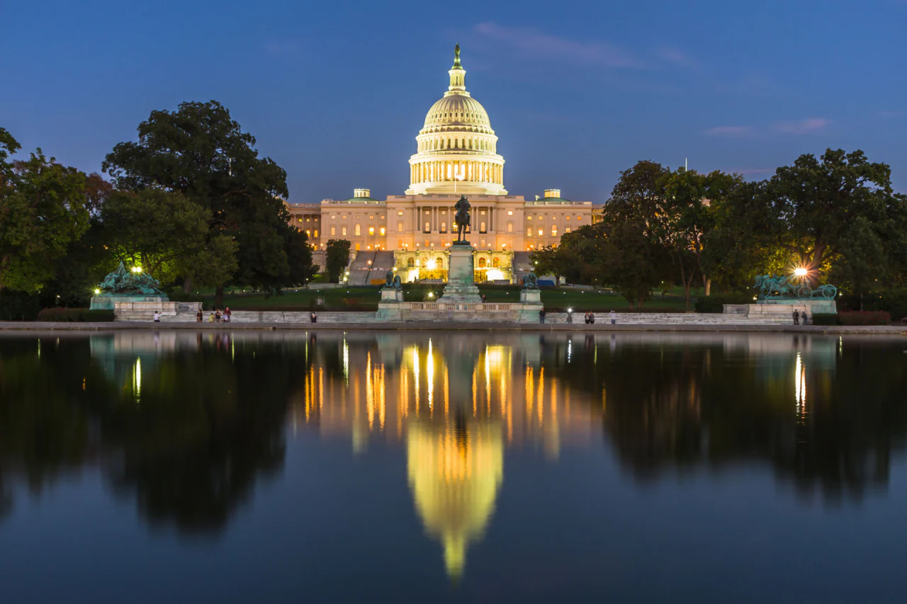 The United States Capitol at dusk, reflected in the Capitol Reflecting Pool